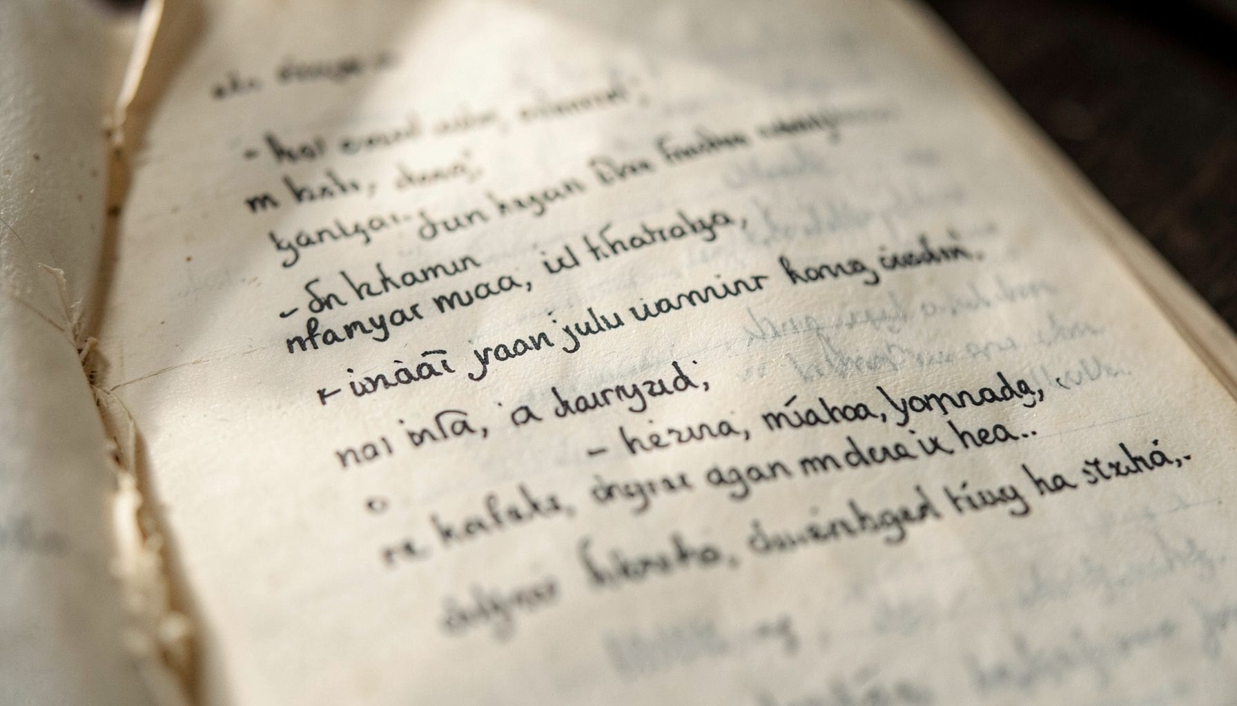 A close-up of a worn lyric notebook page with handwritten Indonesian song verses, soft natural light falling across the paper, warm cream and muted gray tones